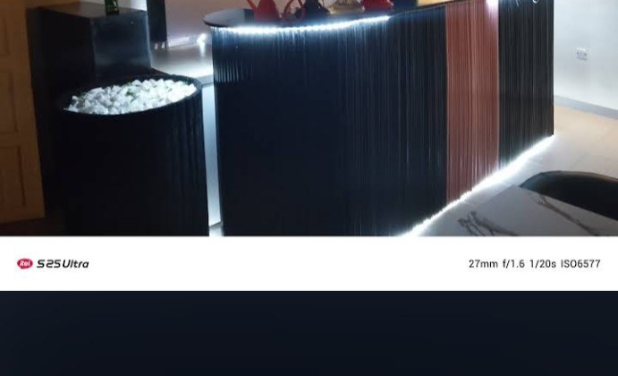 Bar counter with illuminated trim and shelves